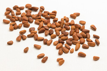 Pine nuts in brown shell.