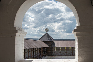 view on the old wooden wall through the arch in Sviyazhsk, Russia