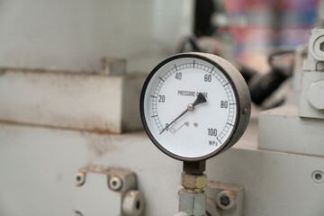 pressure gauge on the old machine background, industrial equipment concept