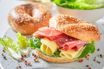 Delicious bagel with cheese and ham for quick lunch