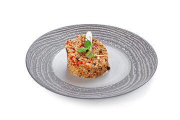 Prepared rice with vegetables on plate isolated on white