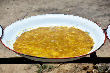 Yellow ripe mango, grind thoroughly, then simmer until thickened, let to dry in the sun.