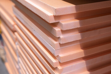 Pink insulation folded neatly in the store