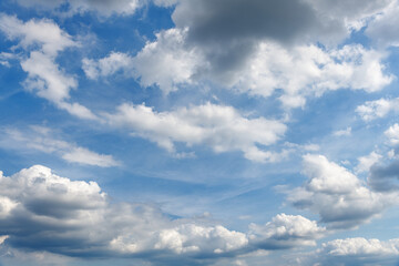 Fototapeta na wymiar Cloudy blue sky background. Abstract vibrant blue cloudscape.