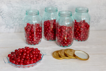 Production of cherry compote in jars. Homemade canned food. The concept of handmade