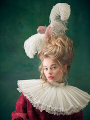 Stylish and trendy. Young woman as Marie Antoinette on dark green background. Retro style,...