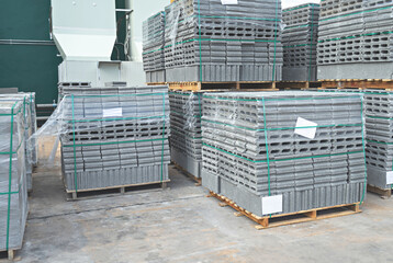Concrete blocks placed on a wooden pallets In the warehouse.