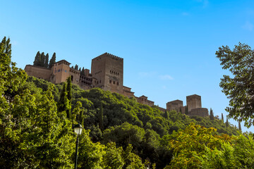 Fototapeta na wymiar A view from the Aljibillo bridge towards the Alhambra in Granada, Spain in the summertime