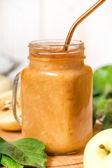Fresh natural organic apple smoothies in a glass jar. 