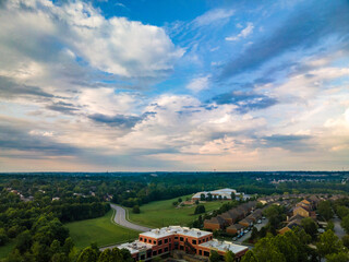 Naklejka premium A view towards neighborhoods and a park in Lexington, KY USA with colorful clouds on the sky