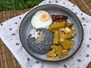 Pumpkin mixed fried egg with fried egg and blue rices and chili