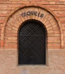 Ticket sales point for the bullfighting celebration in the bullring of Teruel, Spain. It is read in Spanish taquilla