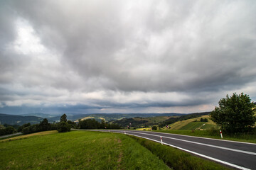 Fototapeta na wymiar Storm clouds over the road