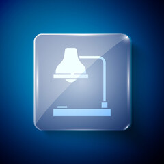 White Table lamp icon isolated on blue background. Table office lamp. Square glass panels. Vector Illustration.