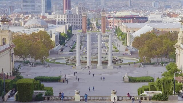 A long view of The Venetian Towers and Magic Fountains on Avinguda de la Reina Maria Cristina at its junction with Pla&ccedil;a d'Espanya in Barcelona, Catalonia, Spain.