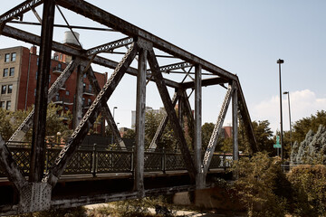 Various steel pedestrian bridges along pathway of Cherry Creek Trail in Downtown, Denver.  Denver, Colorado, USA