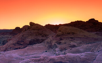 Naklejka na ściany i meble Sunset over the Valley of Fire State Park in the Nevada desert, USA
