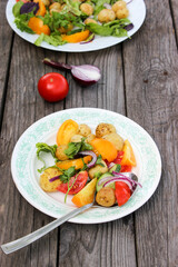 Round new potatoes fried to Golden brown with tomatoes, herbs and lettuce