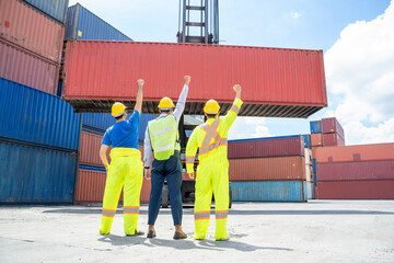 Workers inspecting cargo containers at cargo logistic warehouse,Import and export concept.