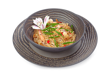 Prepared wok noodles with sliced vegetables on grey dishware