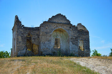 Naklejka premium view of the old ruins of a small orthodox church, from above the blue sky