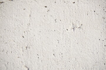 textura de pared blanca en exteriores con detalles de huecos y pintura