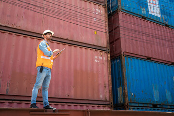 Container worker loading containers box for import export at industrial container cargo.