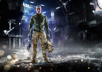 Army soldier in Protective Combat Uniform holding Special Operations Forces Combat Assault Rifle on...