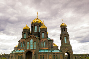 dark color temple with golden domes with geometric park from drone height