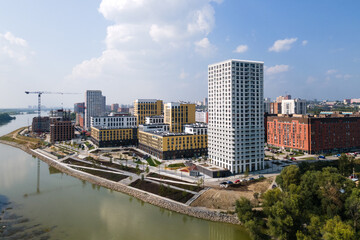 Fototapeta premium modern residential complex in a large city on the river bank. view from the plane