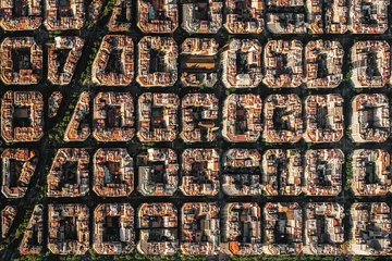 Fotobehang Aerial view of typical buildings of Barcelona cityscape from helicopter. top view, Eixample residencial famous urban grid © ikuday