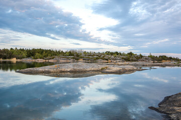 Coastal view in the evening, rocks, sea and reflection, Kumlinge, Aland islands, Finland