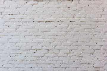 The brick wall is painted with white paint. Background for the designer.