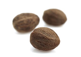 Nutmegs, myristica fragrans, Fruits against White Background