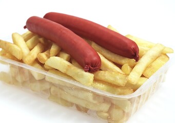 French Fries with Sausage against White Background