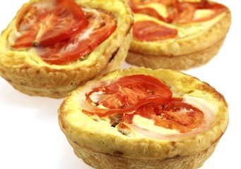 Tuna Quiche with Tomatoe against White Background