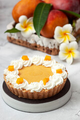 Delicious mango tart on white background