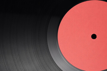 12-inch LP vinyl record disk with blank red label.