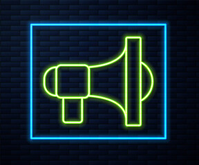 Glowing neon line Megaphone icon isolated on brick wall background. Speaker sign. Vector.