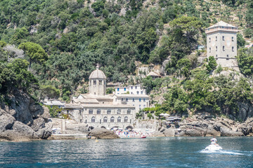 the bay of San Fruttuoso with green water and the abbey near the beach