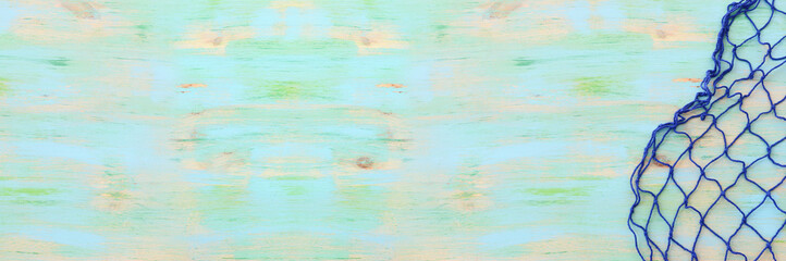 Top view of Fishnet on pastel blue wooden background. top view, flat lay