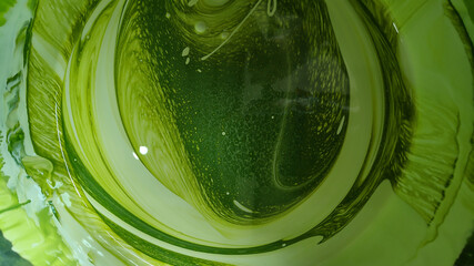 abstract shiny green paint swirly pattern for background