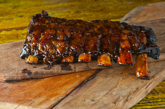 Pork Ribs, Barbecue Style. Classic Traditional Texas Smokehouse Favorite Menu Item: Baby Back Pork Ribs. Slow Cooked In Seasoned Smoker Over Mesquite Wood Chips Covered In Homemade Bbq Sauce.