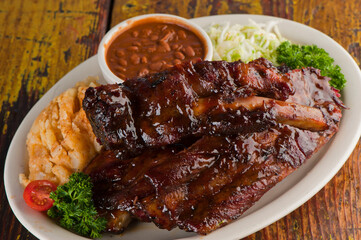 Brisket, pork sausage, pork ribs, beef ribs. Barbecue platter served with classic bbq sides Mac n cheese, cornbread, Brussels sprouts, coleslaw & beer. Classic traditional Texas meats & side dishes.