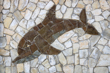 Background of light-colored stone with brown Dolphin.The design of the exterior facade.