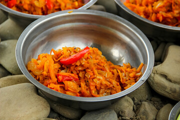 Vegetarian food made on fire served in stainless steel camping plate