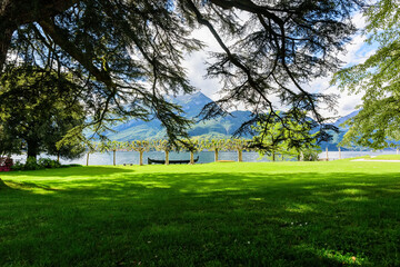Shady lawn and view of Lake Como and the surrounding mountains