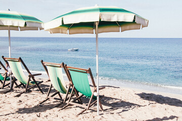 Summer holidays season 2020. Beach without people. Beach, summer, Covid-19, vacation. Empty sunbeds on a beach.