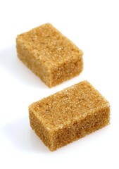 Cubes of Brown Sugar against White Background