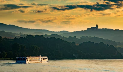 Foto op Plexiglas A river cruise boat on the Danube river in the Melk District, lower Austria near Sausenstein © Bob